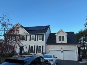 All-black residential solar panel installation on a dark shingle roof in Hopkinton, MA by Brightstar Solar.