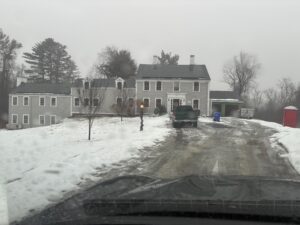 Sleek all-black solar panels installed on a dark-shingled roof in Southborough, MA, showing a discreet and uniform design that blends into the home's architecture.